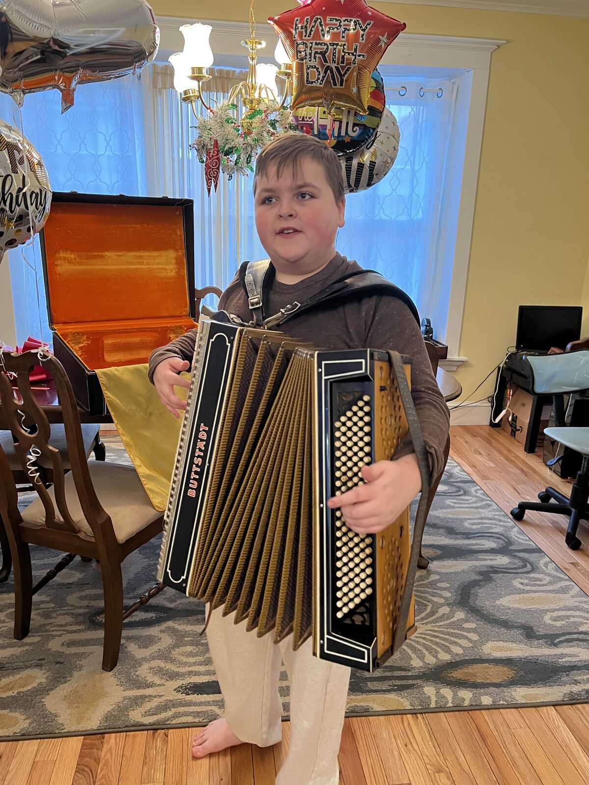Brahm trying accordions at an accordion warehouse